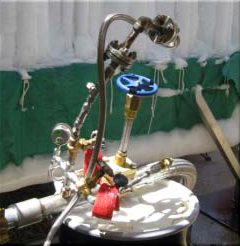 Christmas tree connection and flare with control valve connecting to plant mass flow meters below