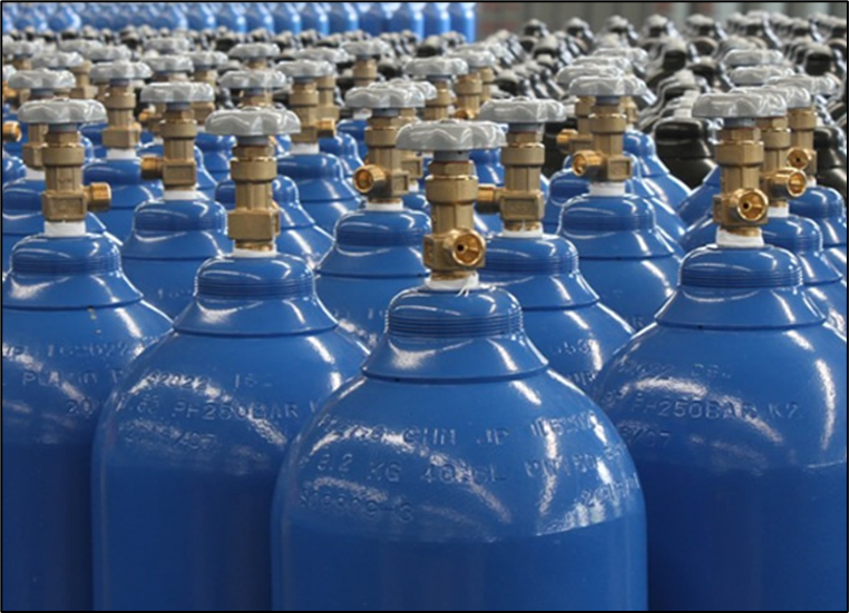 Helium gas cylinders at an outdoor storage unit.